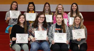Students holding awards for Academic All State